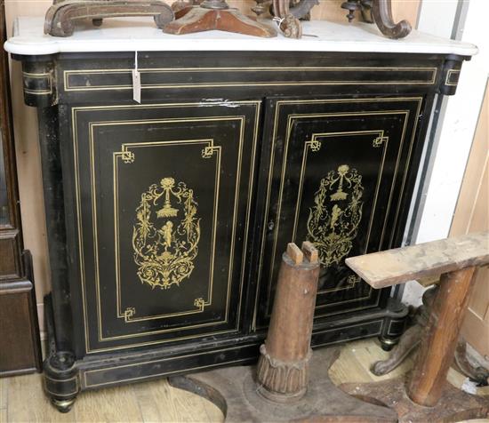 A late 19th century French brass inlaid ebonised marble top side cabinet W.125cm